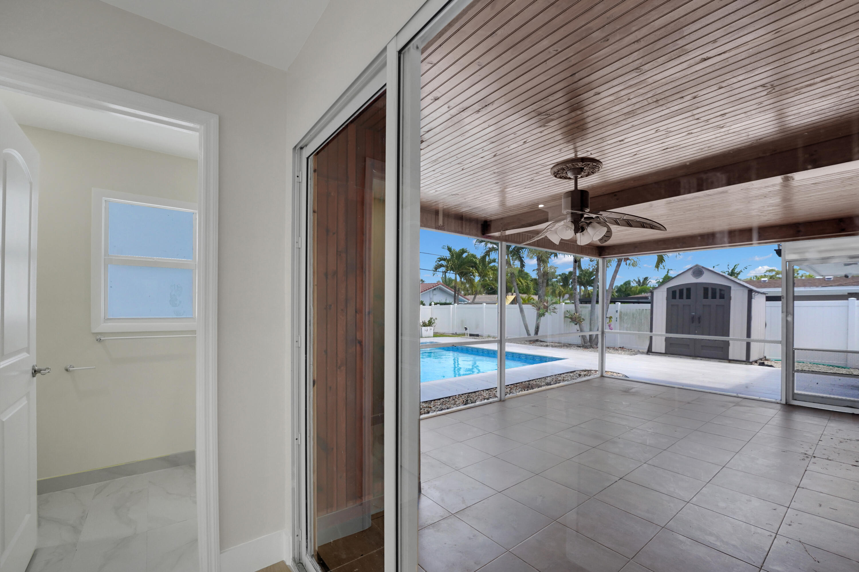 600 Northwest 12th Avenue Boca Raton, FL 33486 - Photo 24 of 63 a view of a patio with a table and chairs under an umbrella