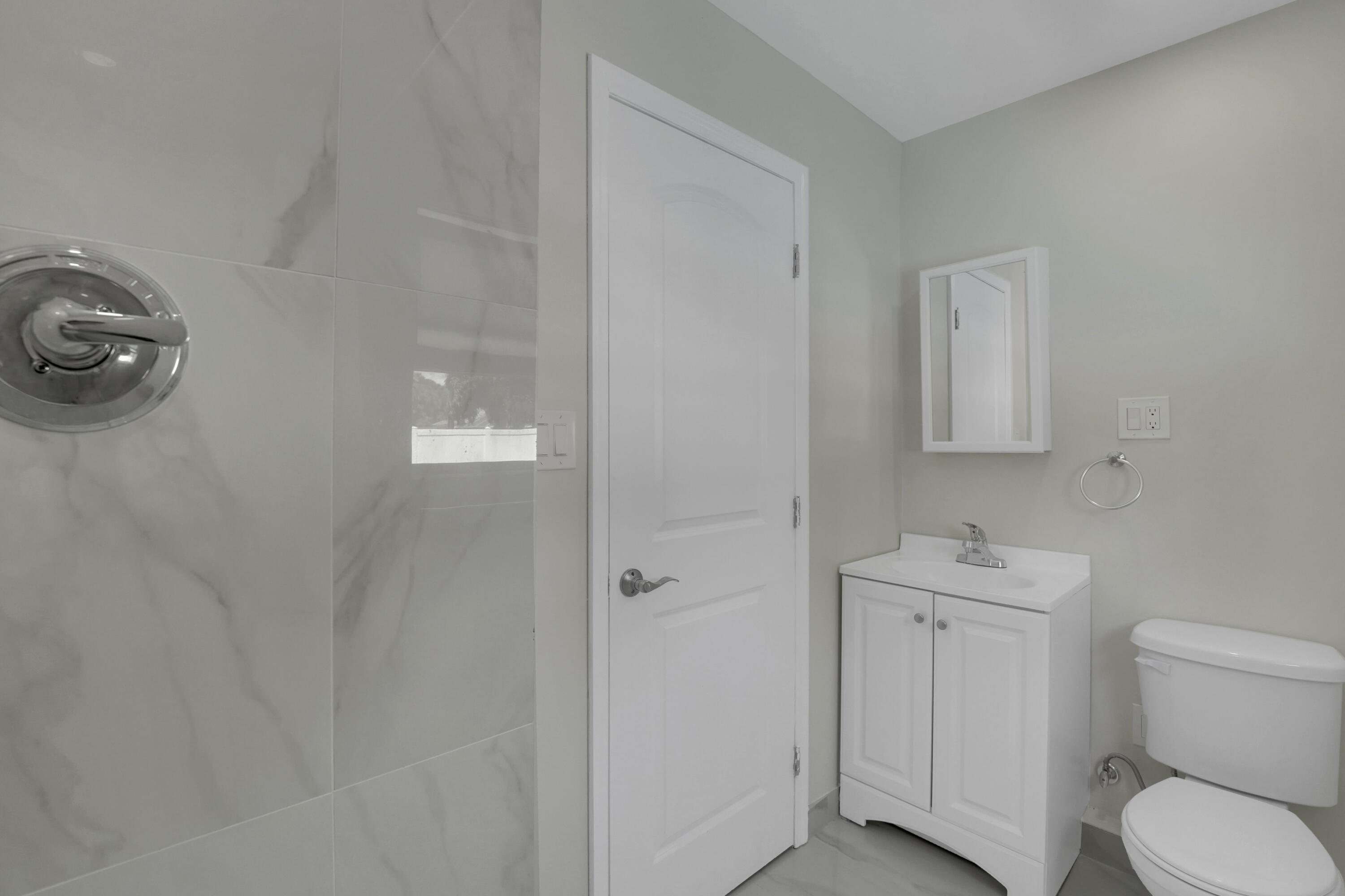 600 Northwest 12th Avenue Boca Raton, FL 33486 - Photo 28 of 63 a bathroom with a toilet a sink and mirror