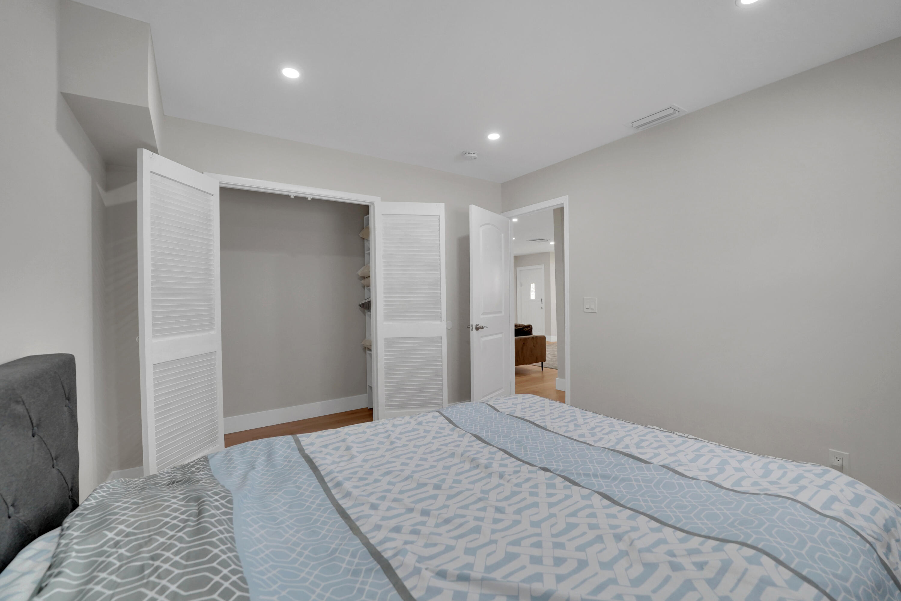 600 Northwest 12th Avenue Boca Raton, FL 33486 - Photo 35 of 63 a bedroom with a bed and a dresser