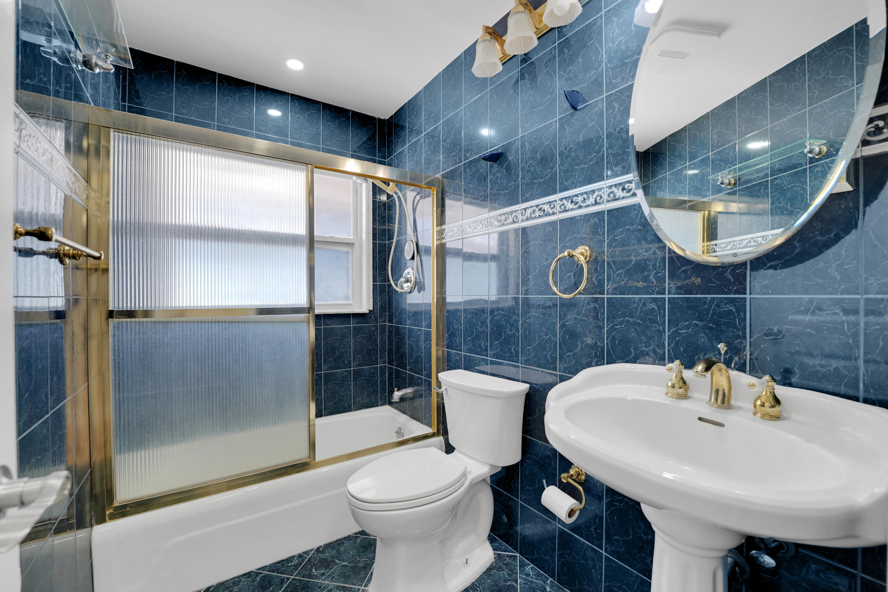 600 Northwest 12th Avenue Boca Raton, FL 33486 - Photo 37 of 63 a bathroom with a sink a toilet and shower
