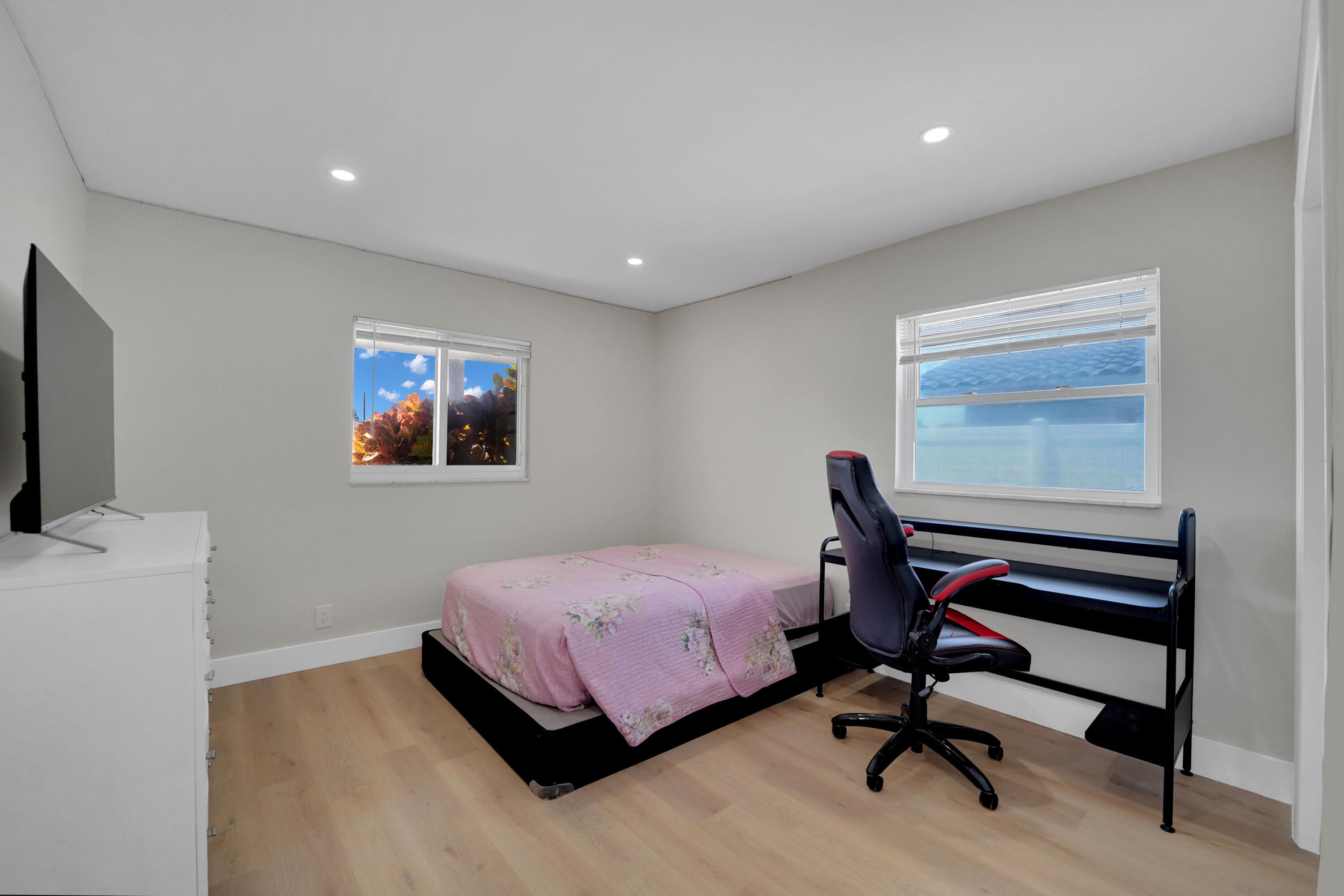 600 Northwest 12th Avenue Boca Raton, FL 33486 - Photo 40 of 63 a bedroom with a bed and a dresser