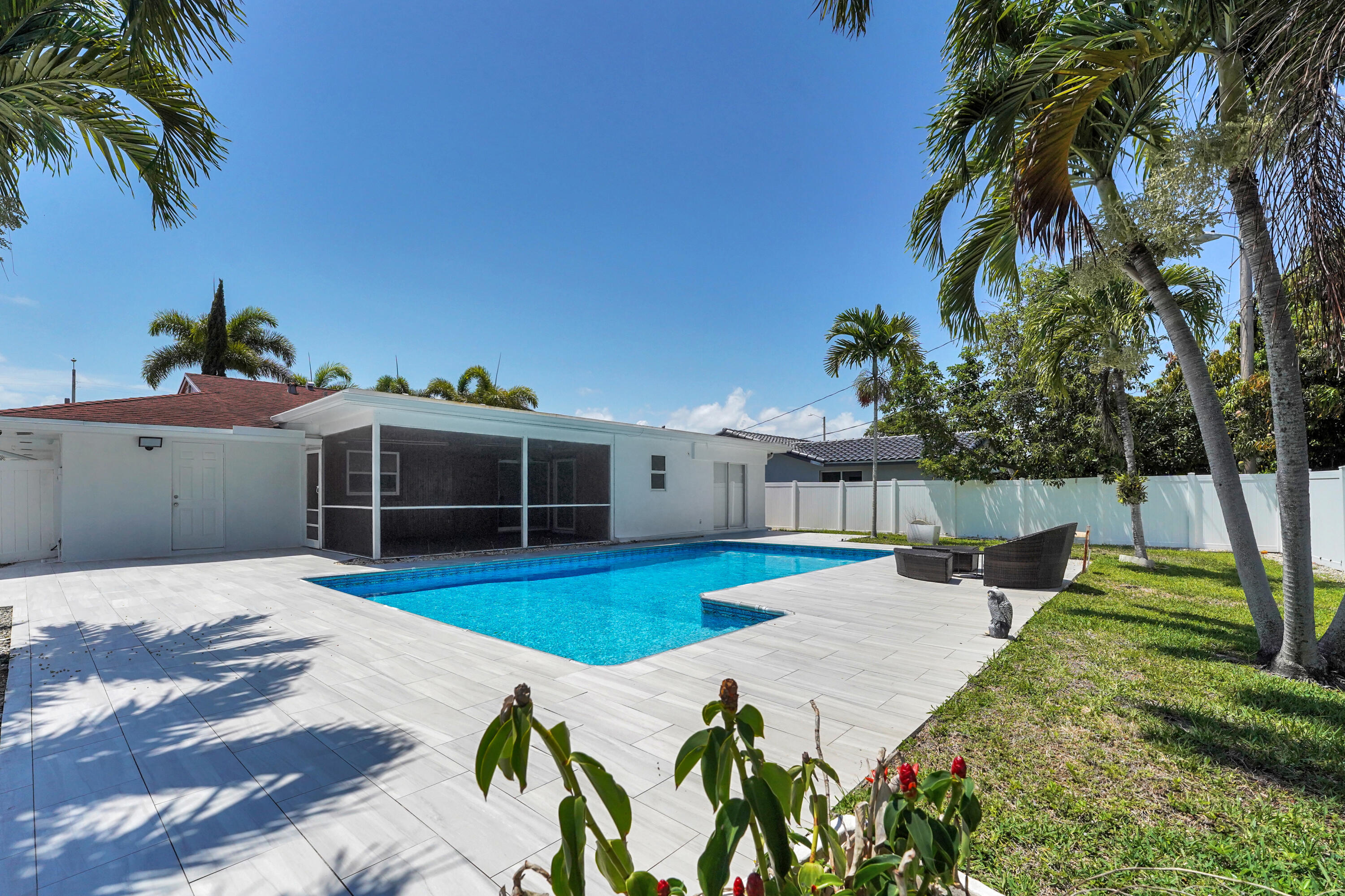 600 Northwest 12th Avenue Boca Raton, FL 33486 - Photo 52 of 63 a view of a house with swimming pool and sitting area
