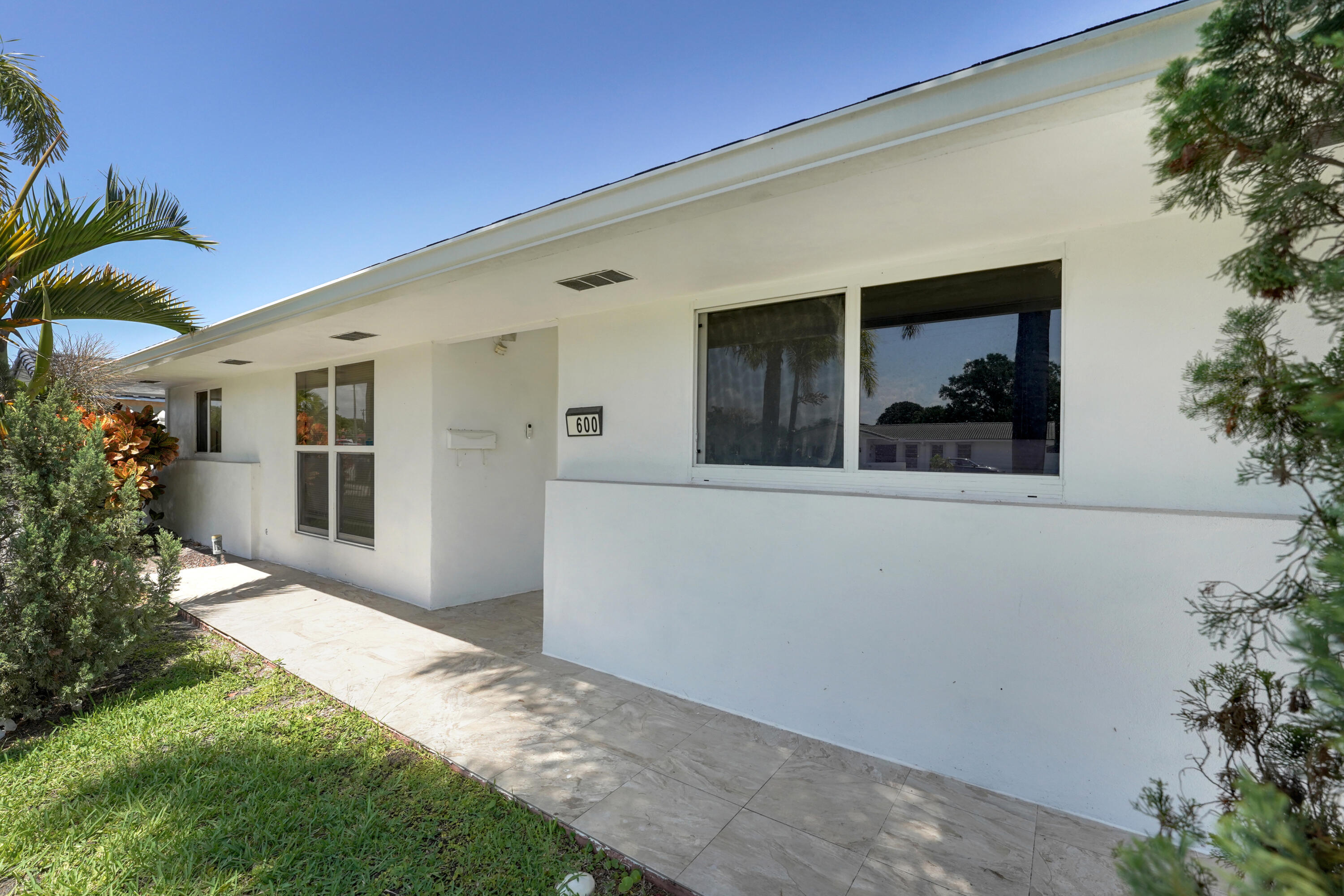 600 Northwest 12th Avenue Boca Raton, FL 33486 - Photo 61 of 63 a view of a house with a yard