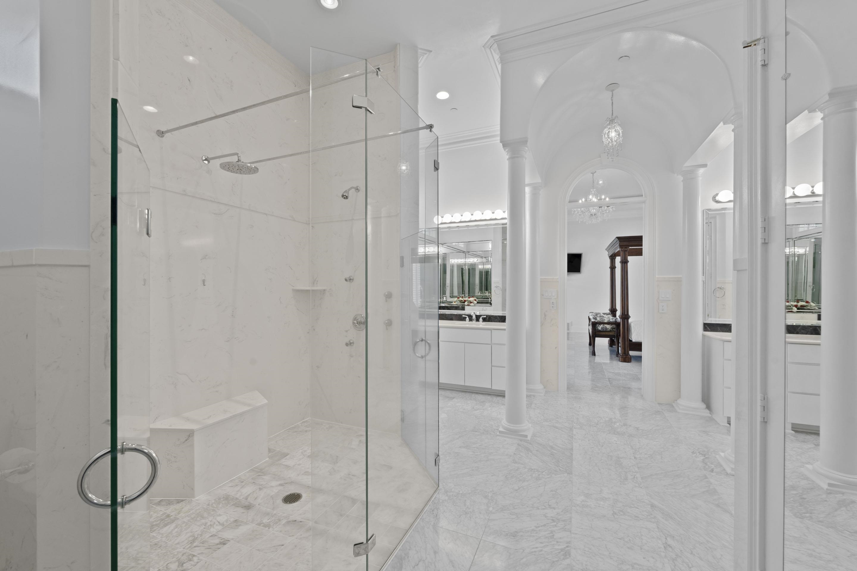 881 Bray Station Road Collierville, TN 38017 - Photo 25 of 40 Full bath featuring ornate columns, a marble finish shower, a chandelier, vanity, and marble finish floors