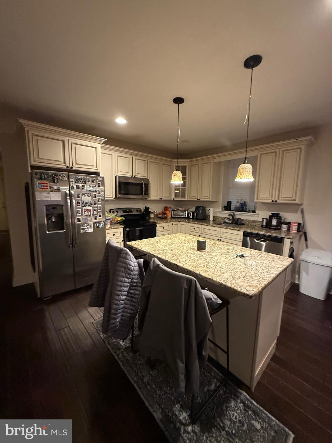 6110 Ridge Avenue Philadelphia, PA 19128 - Photo 1 of 9 a kitchen with stainless steel appliances granite countertop a sink refrigerator stove and microwave