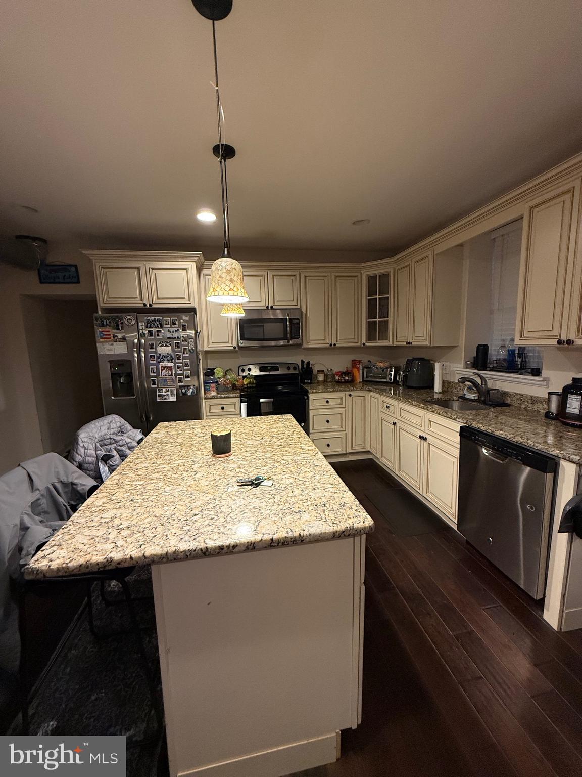 6110 Ridge Avenue Philadelphia, PA 19128 - Photo 3 of 9 a kitchen with stainless steel appliances granite countertop a sink a stove top oven a counter space and cabinets