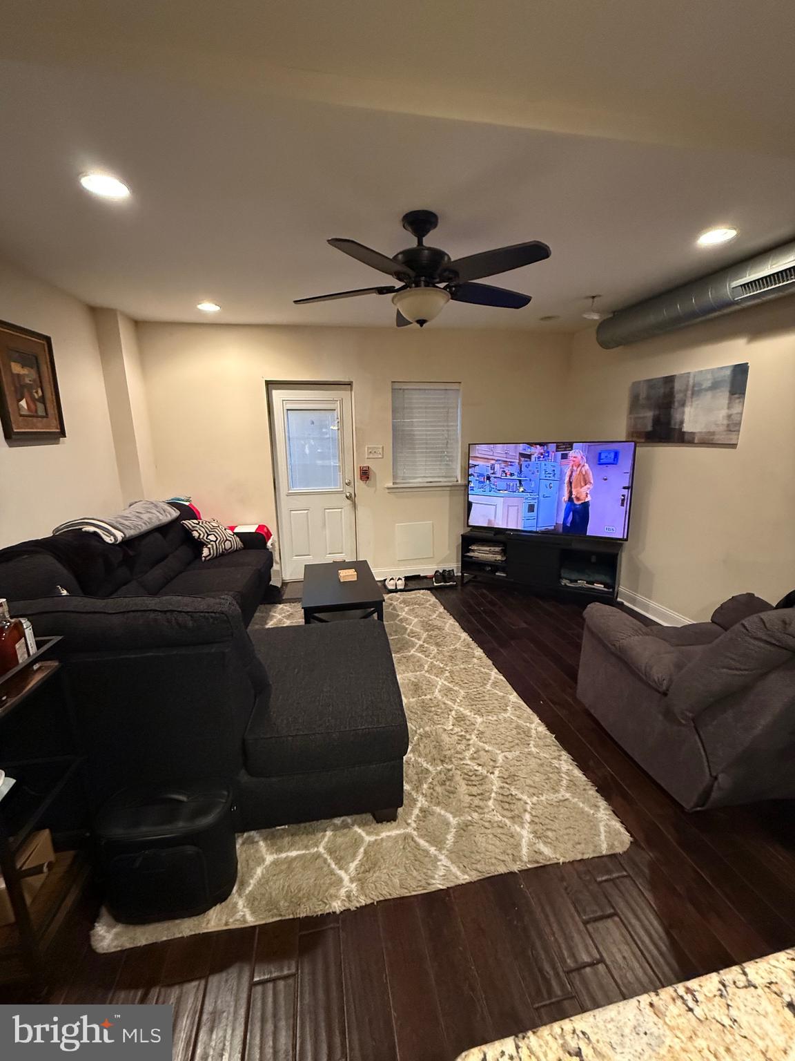6110 Ridge Avenue Philadelphia, PA 19128 - Photo 5 of 9 a living room with furniture and a flat screen tv