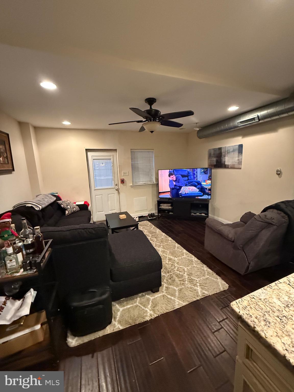 6110 Ridge Avenue Philadelphia, PA 19128 - Photo 6 of 9 a living room with furniture and a flat screen tv