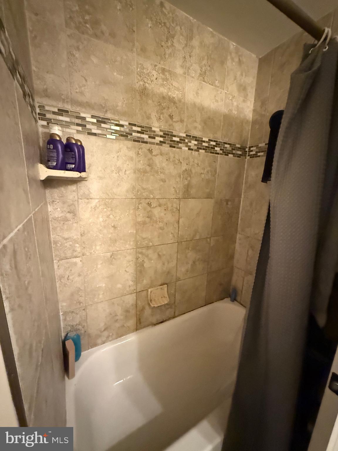 6110 Ridge Avenue Philadelphia, PA 19128 - Photo 7 of 9 a bathroom with a bathtub and shower