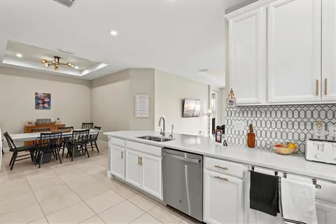 a kitchen with a sink and cabinets