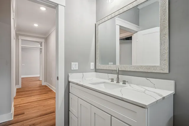 a bathroom with a sink and a mirror