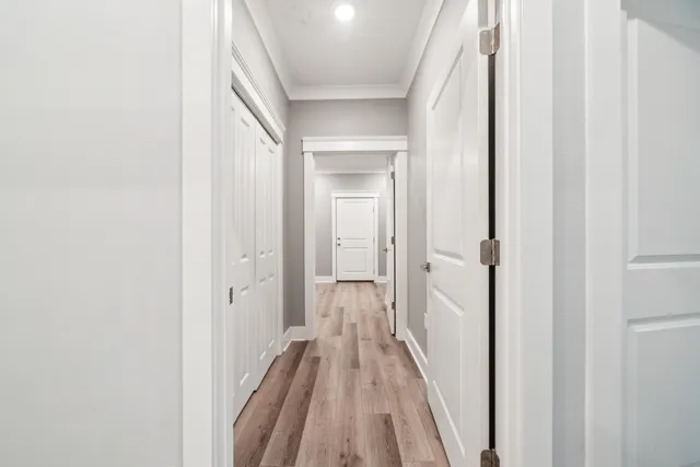 a view of a small space with wooden floor