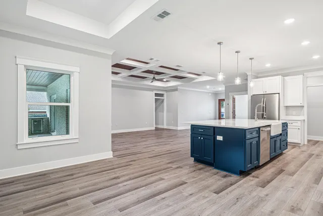 a view of kitchen and wooden floor