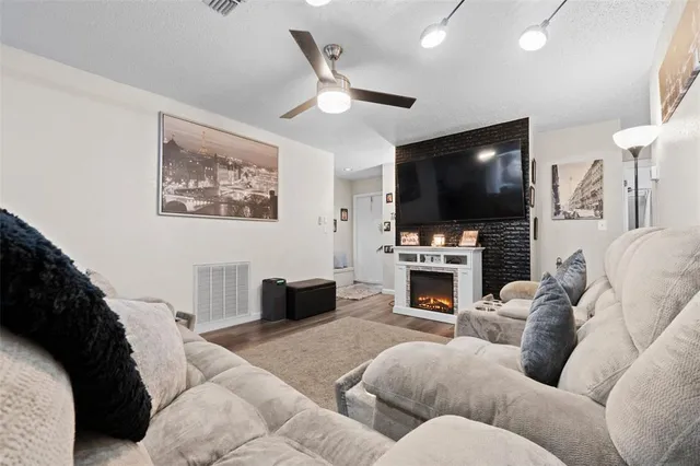 a dining room with furniture and wooden floor