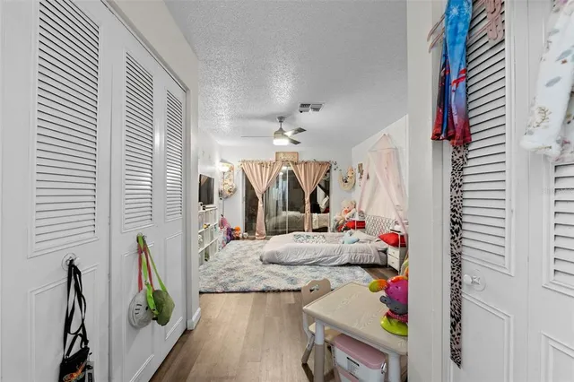a bathroom with a granite countertop sink toilet and a mirror