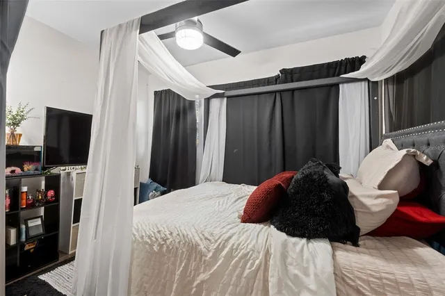 a bedroom with a bed and a dresser