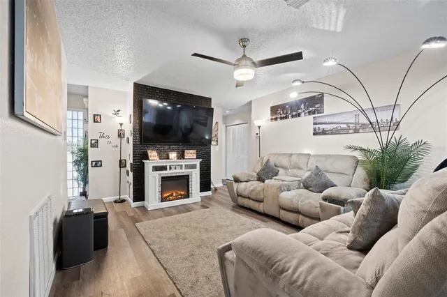 a living room with furniture and a fireplace