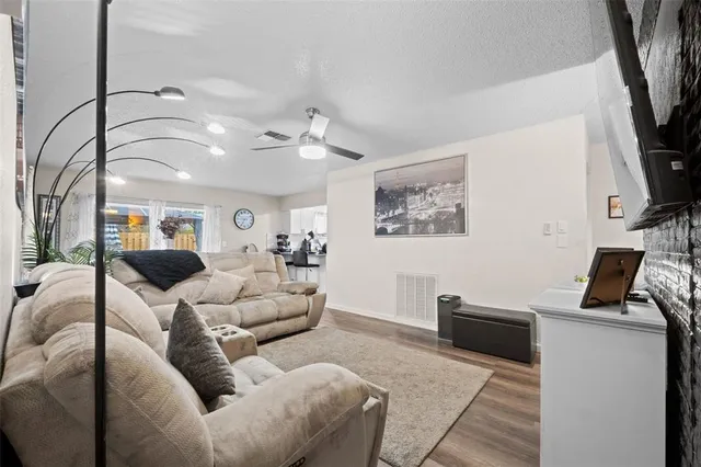 a building outdoor space with patio furniture and potted plants
