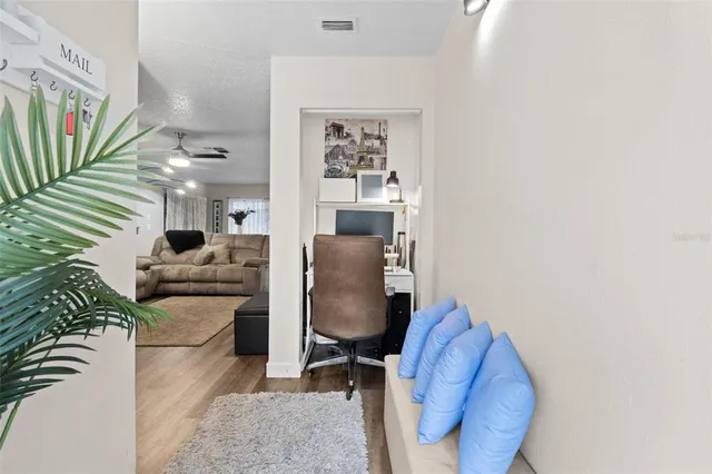 a living room with furniture and a chair