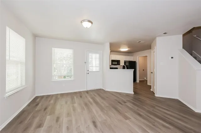 a view of a kitchen with a sink and a window