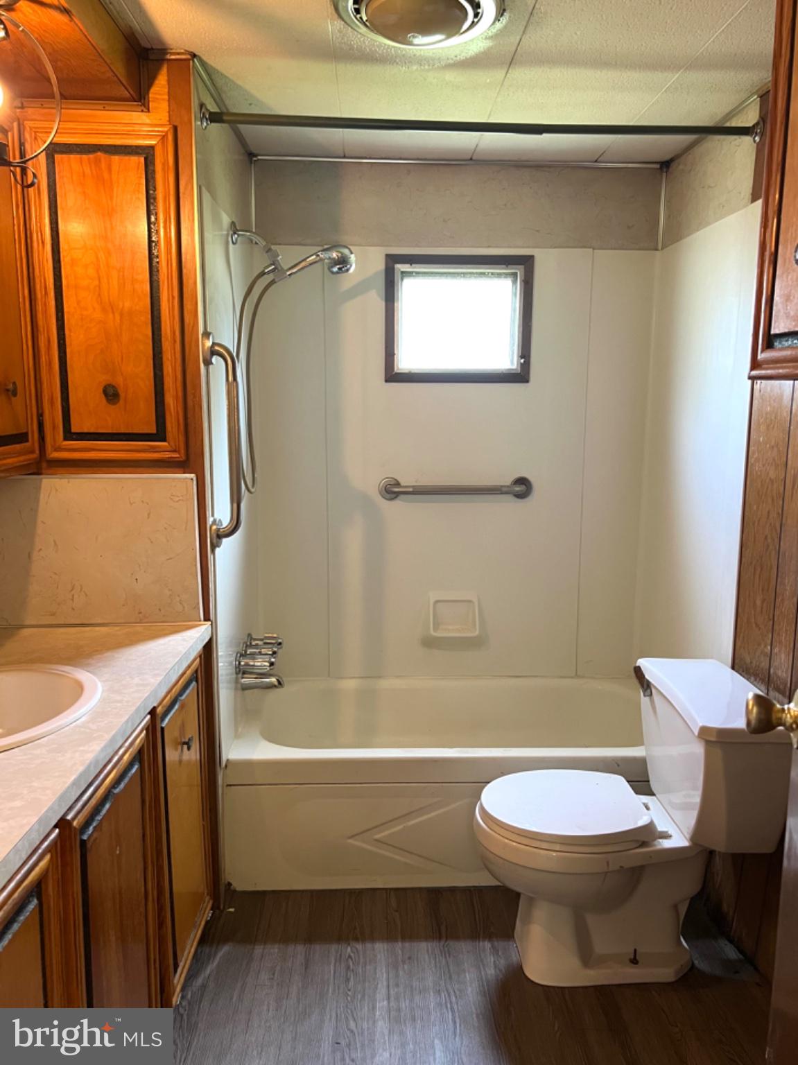 1302 Gibson Road, Unit 152 Bensalem, PA 19020 - Photo 12 of 18 a bathroom with a sink a toilet and shower