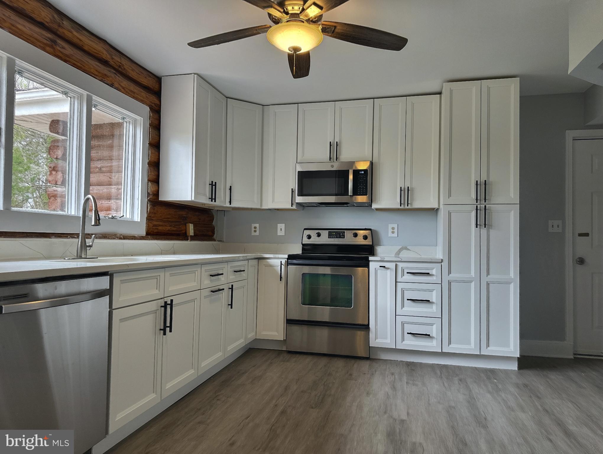 9513 Huntmaster Road Gaithersburg, MD 20882 - Photo 11 of 51 a kitchen with a sink appliances and cabinets