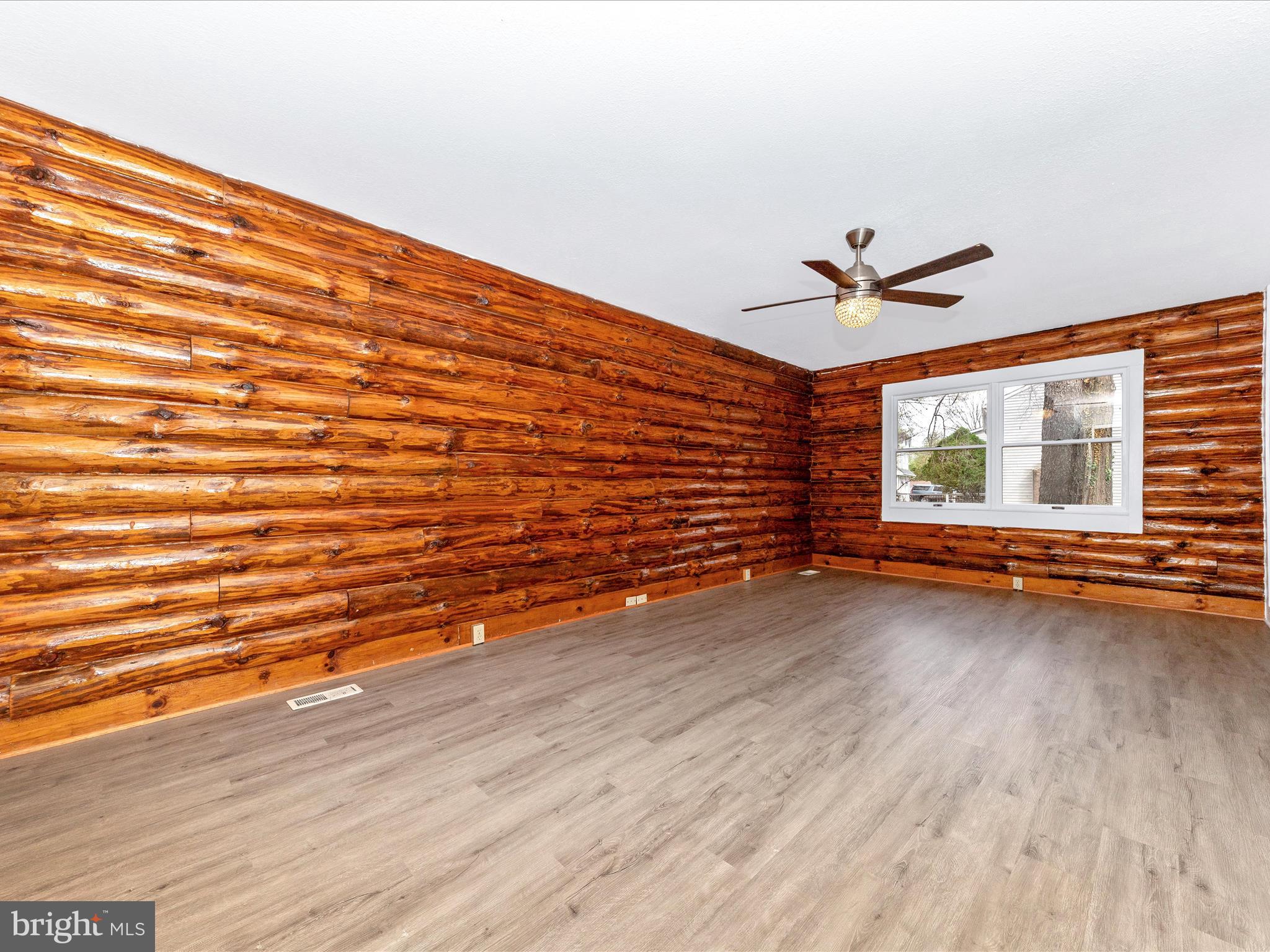 9513 Huntmaster Road Gaithersburg, MD 20882 - Photo 15 of 51 an empty room with wooden floor and windows
