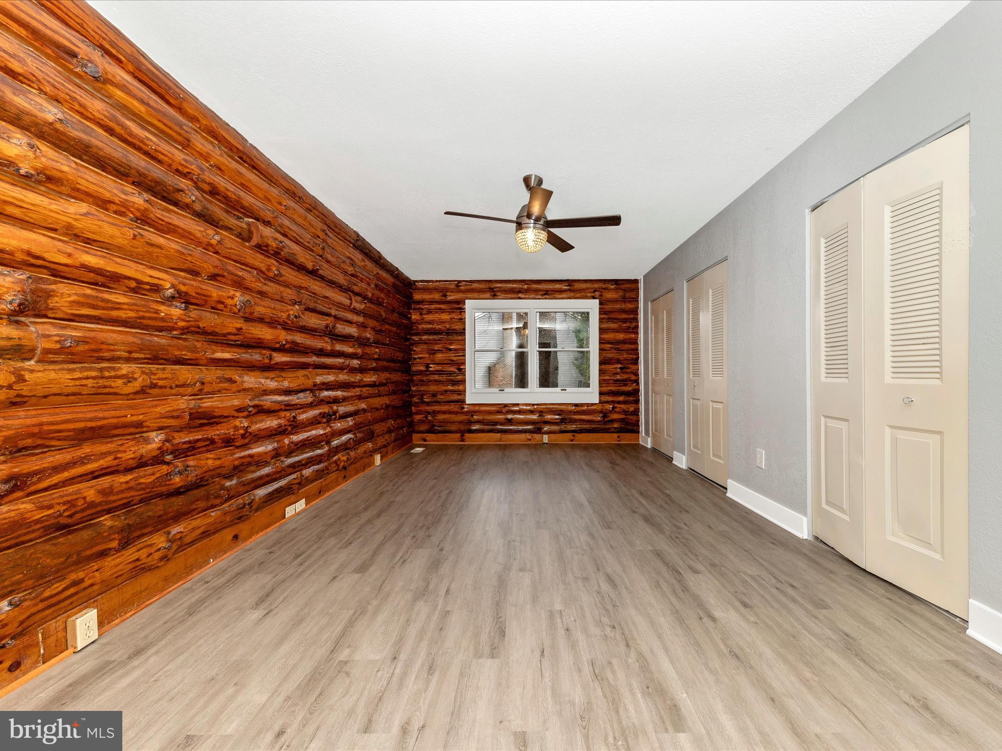 9513 Huntmaster Road Gaithersburg, MD 20882 - Photo 16 of 51 wooden floor in an empty room with a window