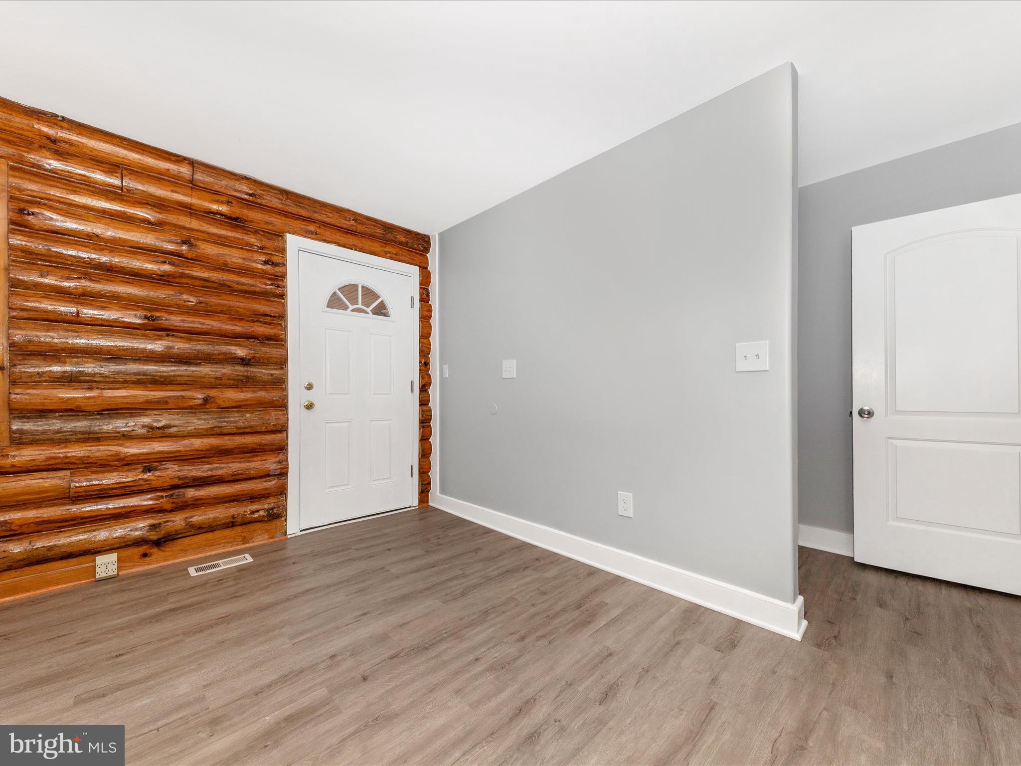 9513 Huntmaster Road Gaithersburg, MD 20882 - Photo 2 of 51 a view of an empty room with wooden floor