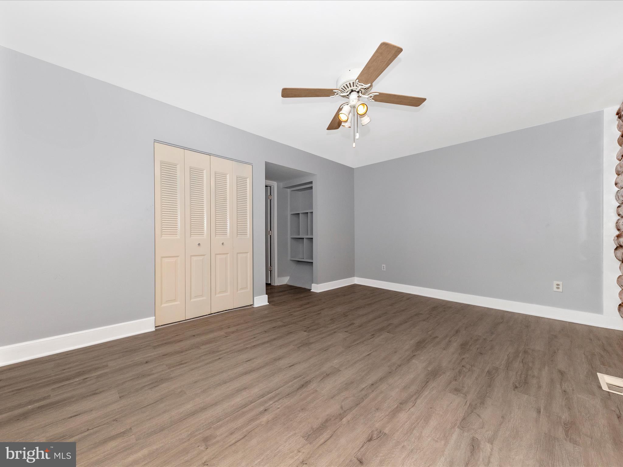 9513 Huntmaster Road Gaithersburg, MD 20882 - Photo 23 of 51 a view of empty room with wooden floor and ceiling fan