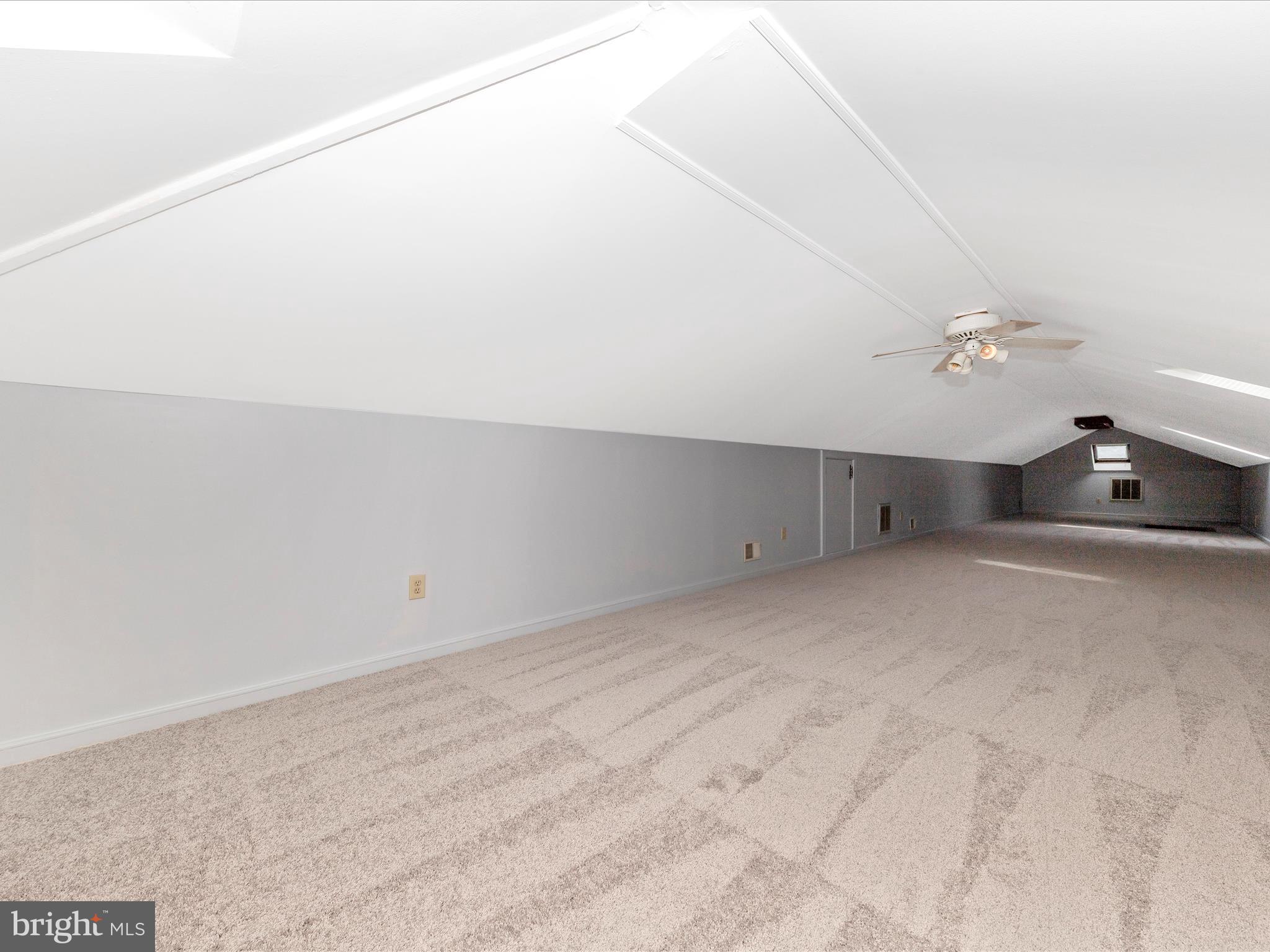 9513 Huntmaster Road Gaithersburg, MD 20882 - Photo 25 of 51 a view of a room with closet and ceiling fan