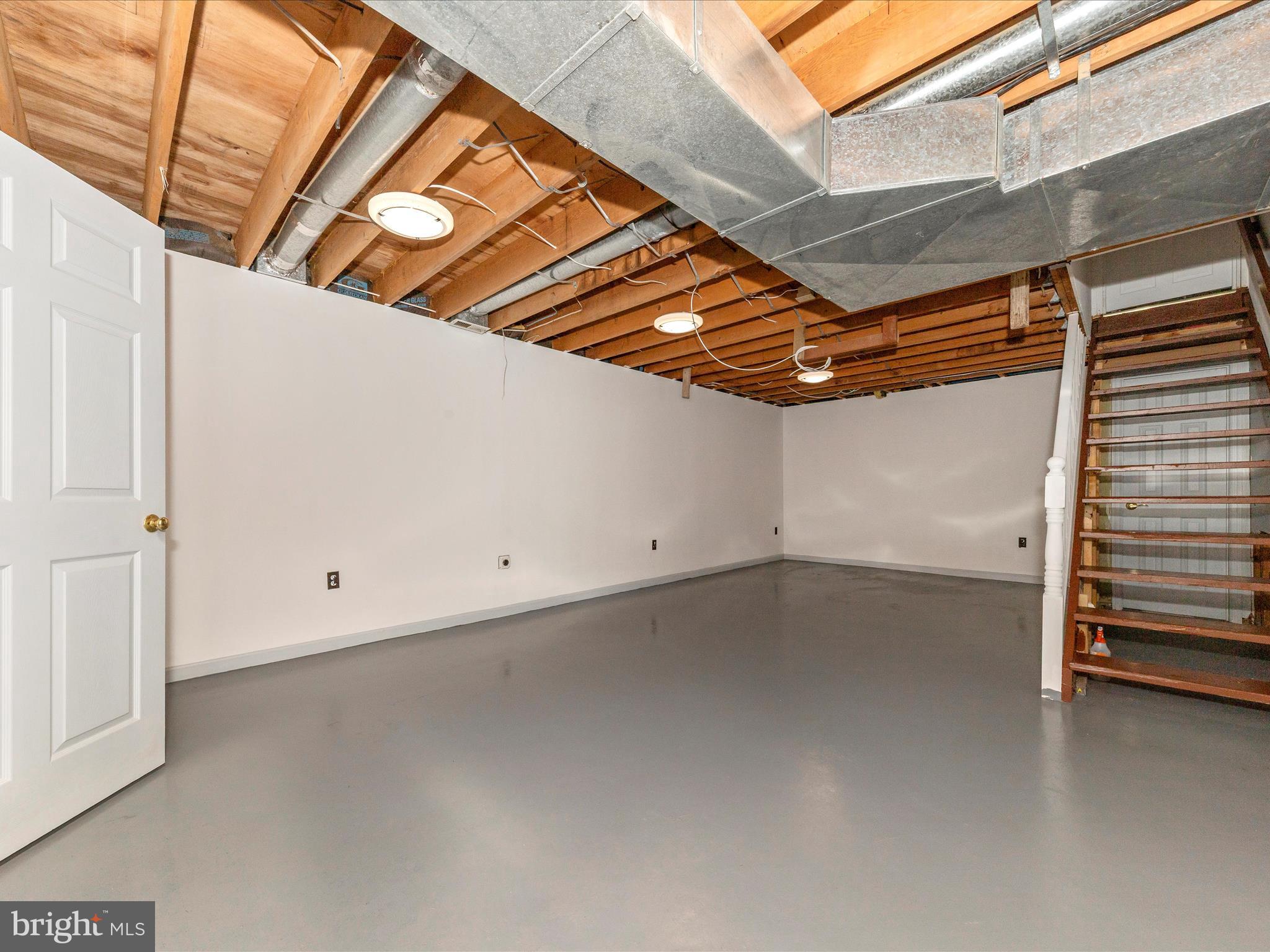 9513 Huntmaster Road Gaithersburg, MD 20882 - Photo 27 of 51 a view of a room with racks on the wall