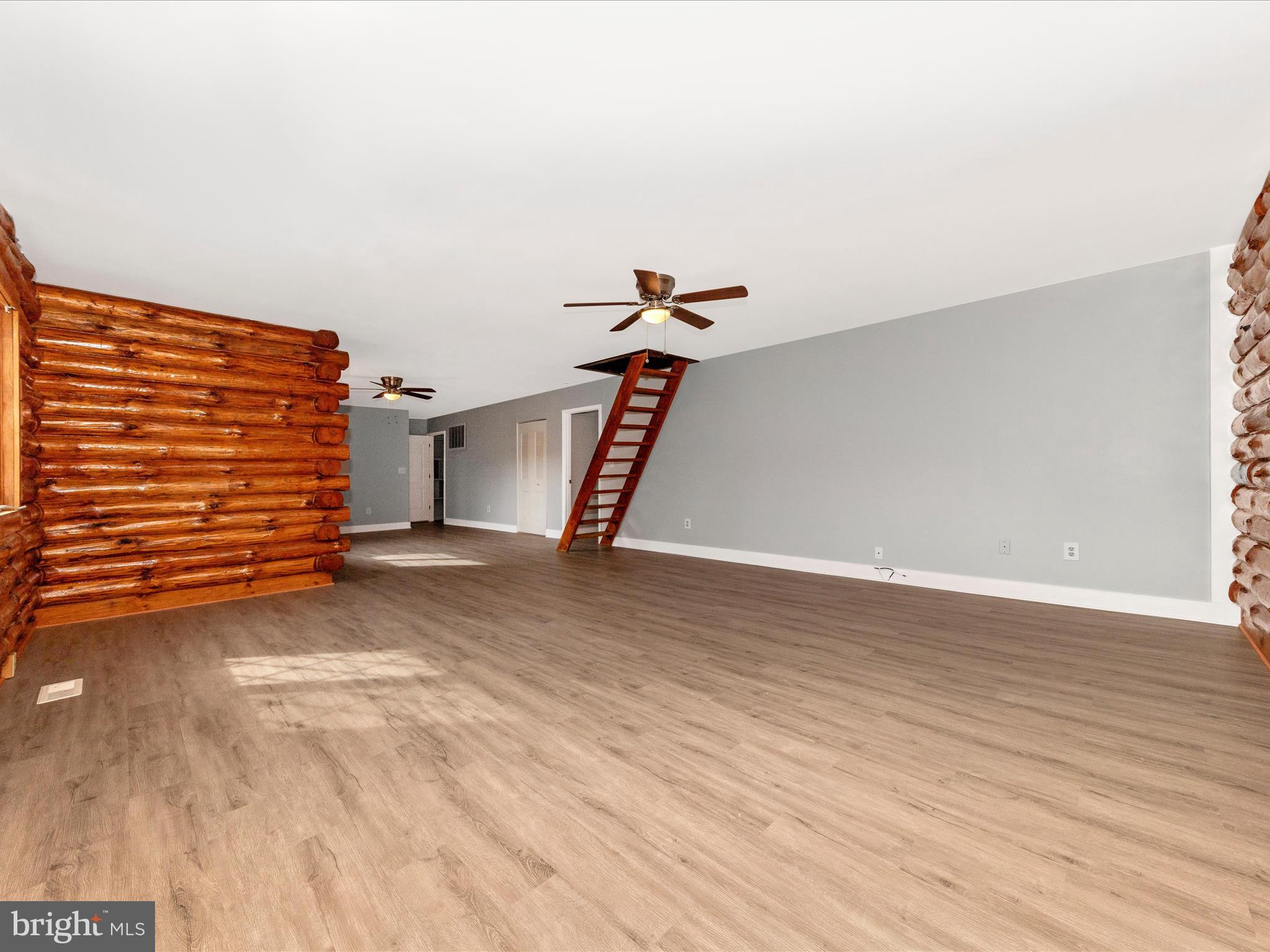 9513 Huntmaster Road Gaithersburg, MD 20882 - Photo 8 of 51 a view of a room with wooden floor