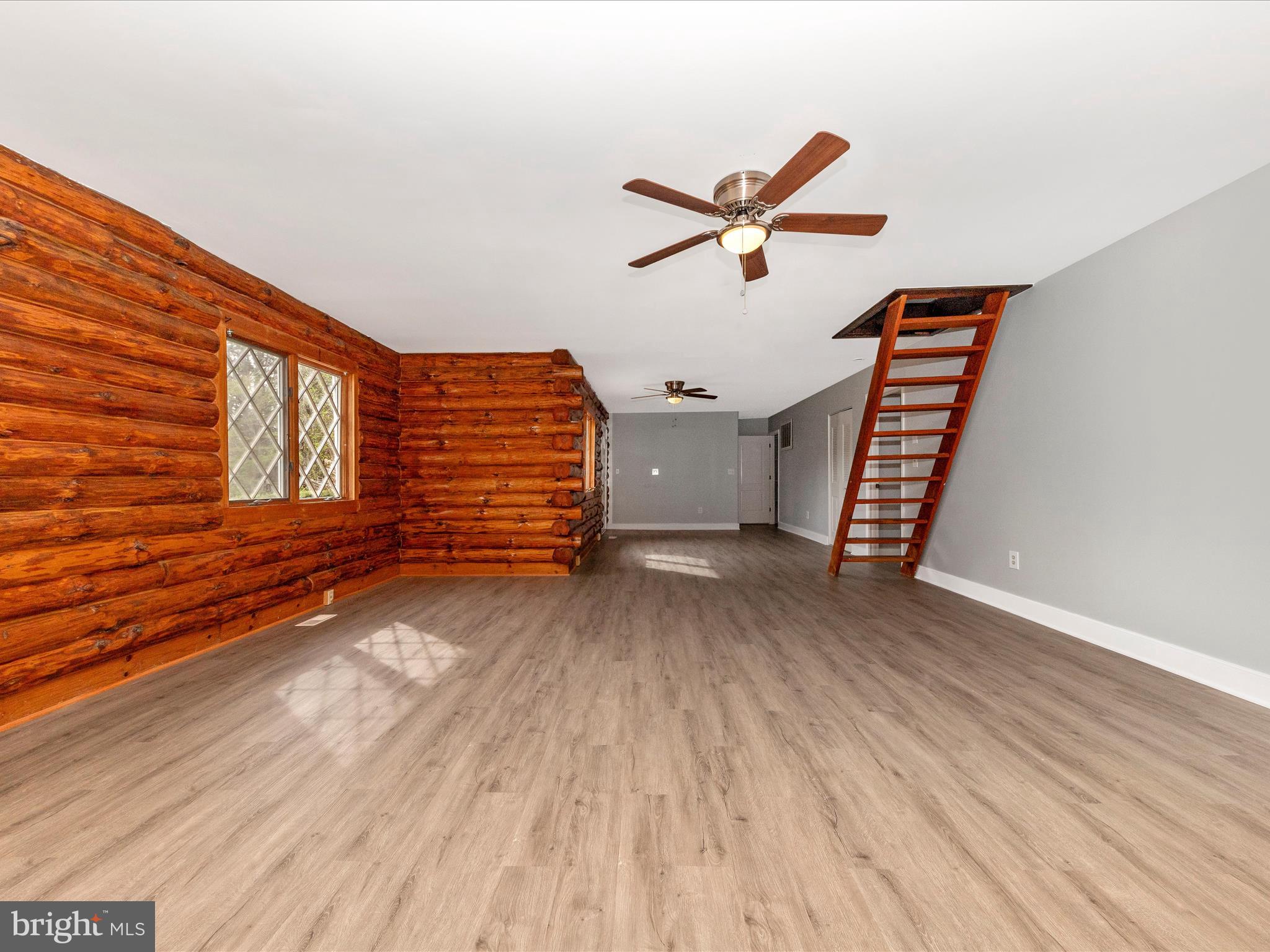 9513 Huntmaster Road Gaithersburg, MD 20882 - Photo 9 of 51 a view of a room with wooden floor and window