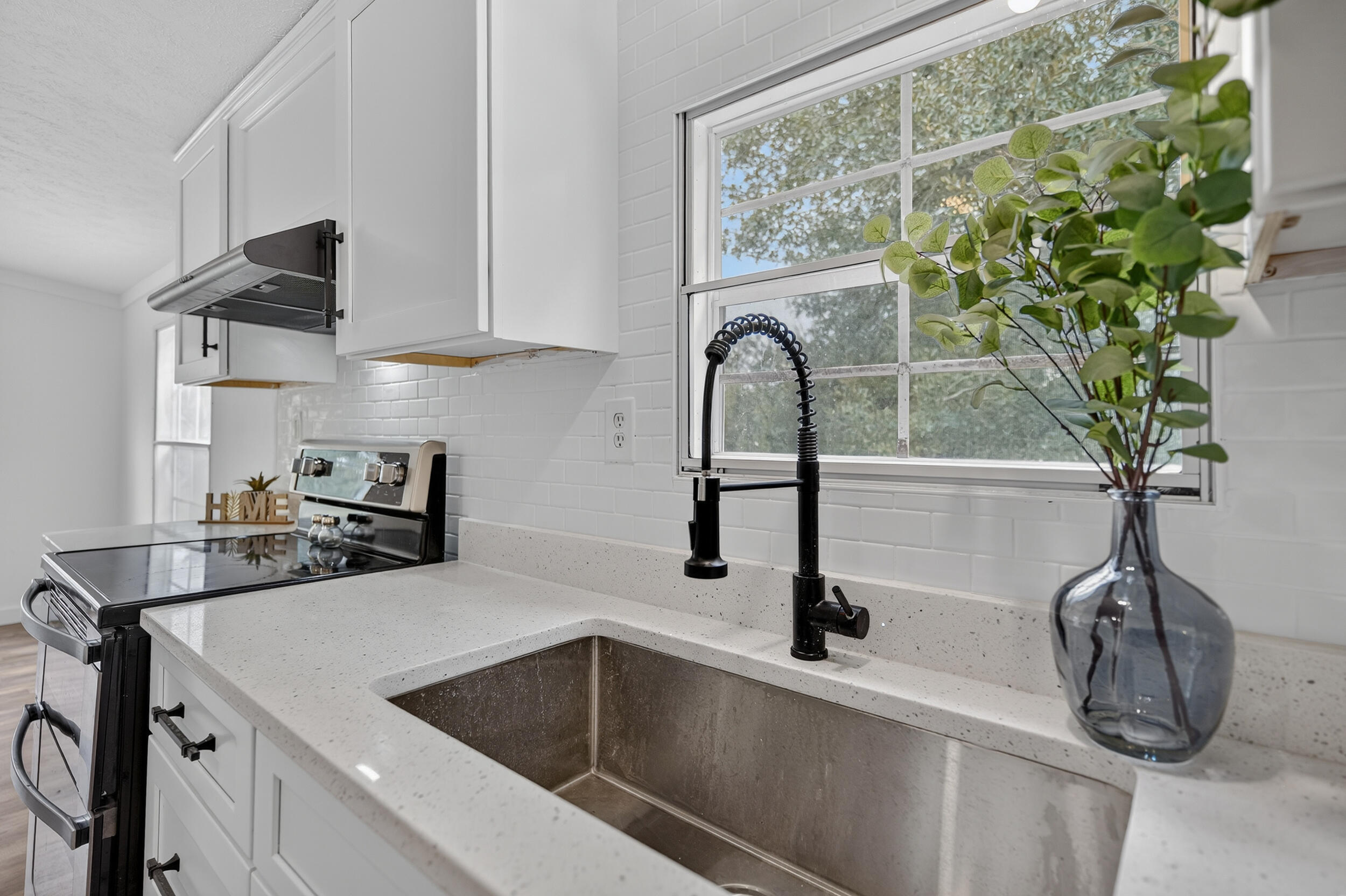 4580 Rainbird Rise Road Crestview, FL 32539 - Photo 15 of 41 a kitchen with a sink and a stove