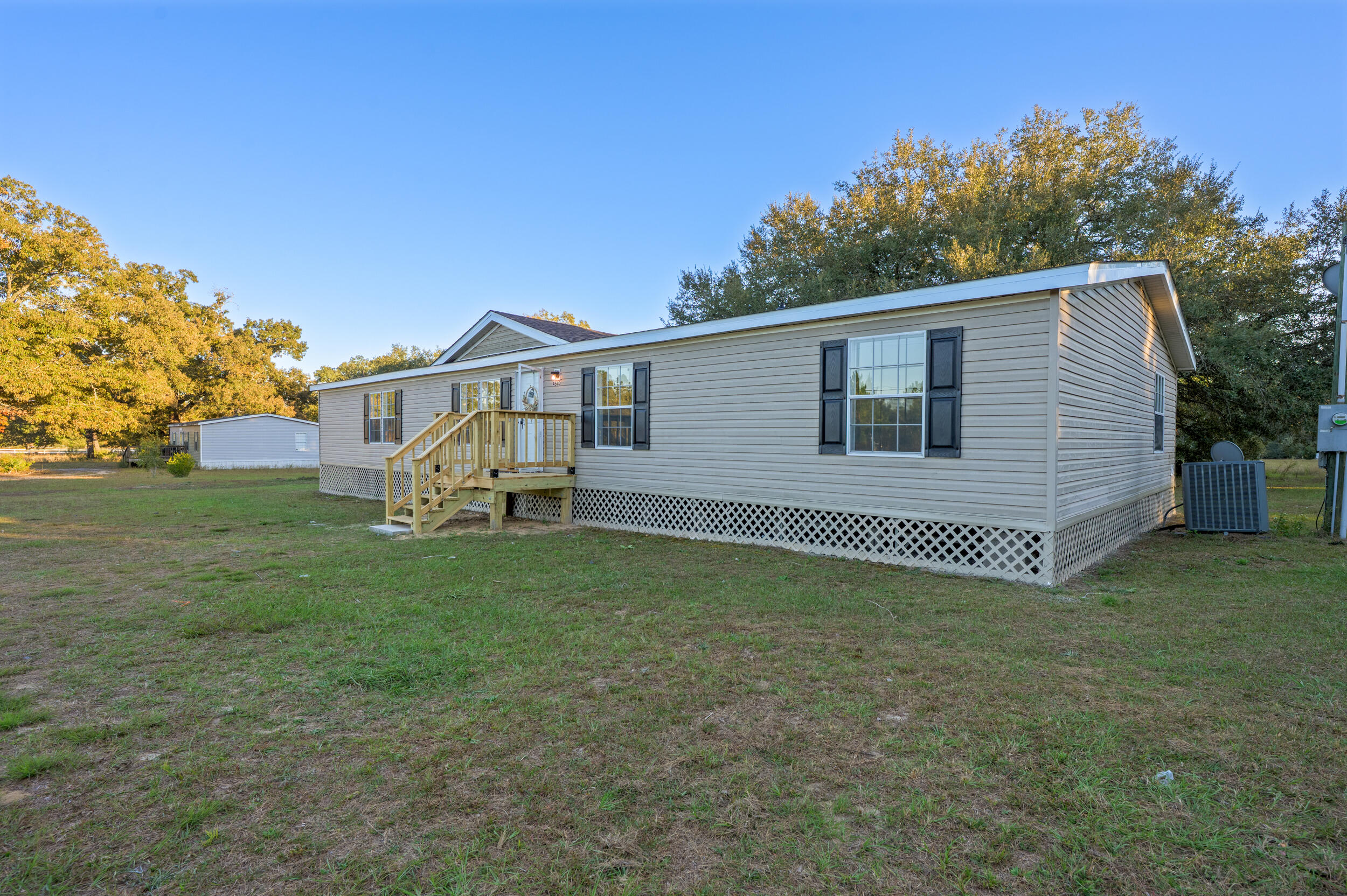 4580 Rainbird Rise Road Crestview, FL 32539 - Photo 2 of 41 a view of a house with a backyard
