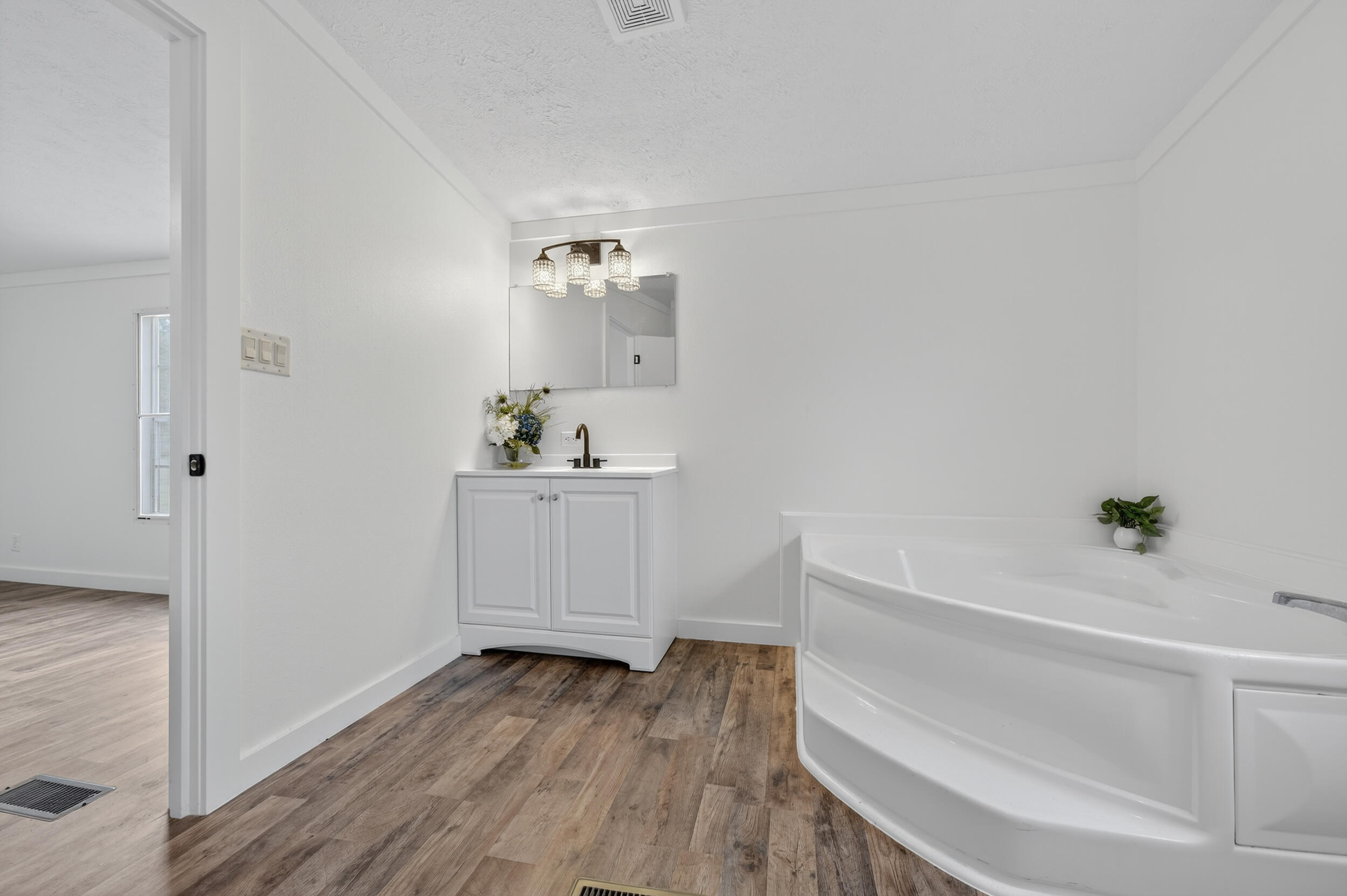 4580 Rainbird Rise Road Crestview, FL 32539 - Photo 26 of 41 a bathroom with a bathtub sink and toilet