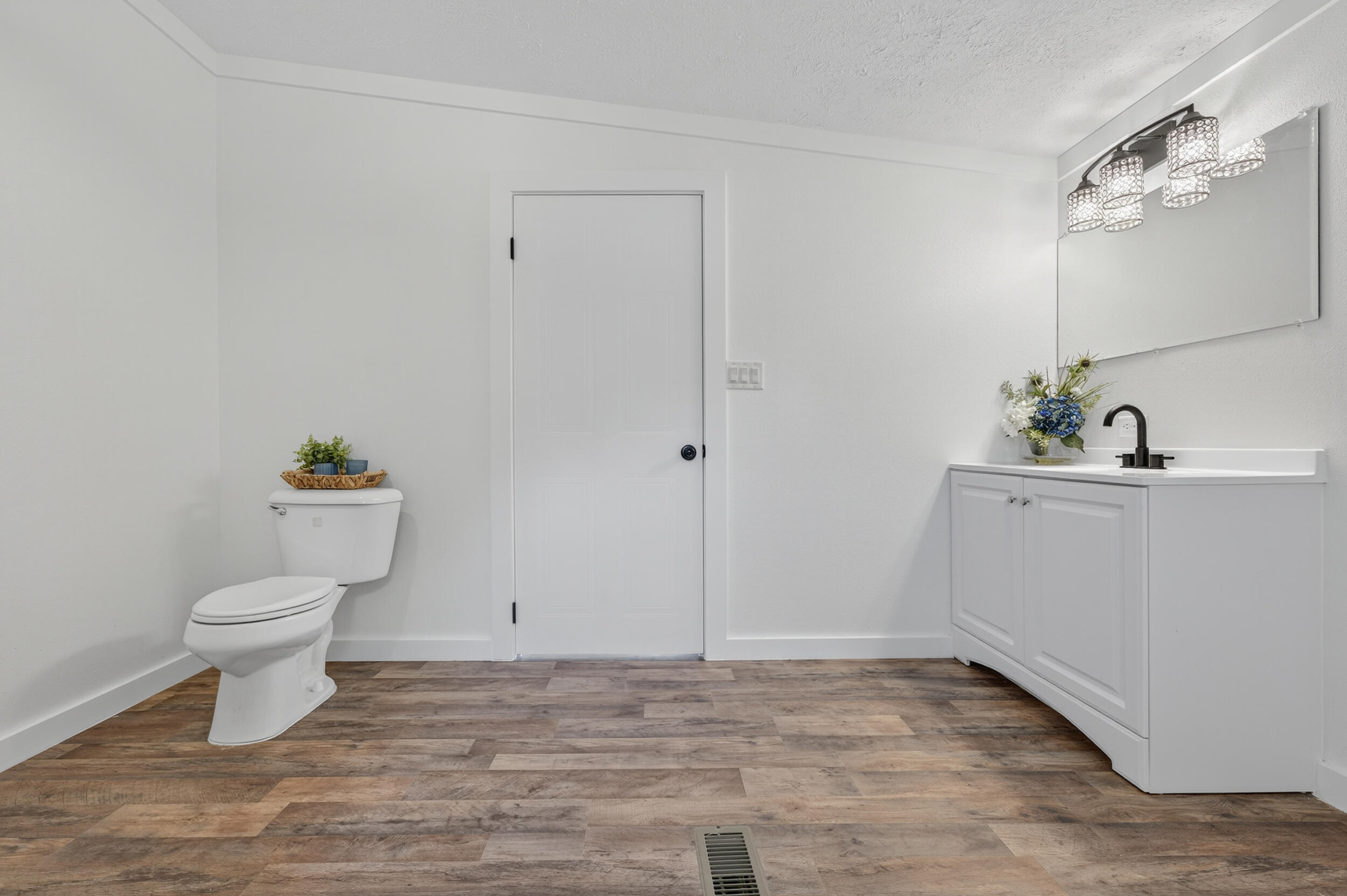 4580 Rainbird Rise Road Crestview, FL 32539 - Photo 28 of 41 a bathroom with a sink a toilet and a mirror