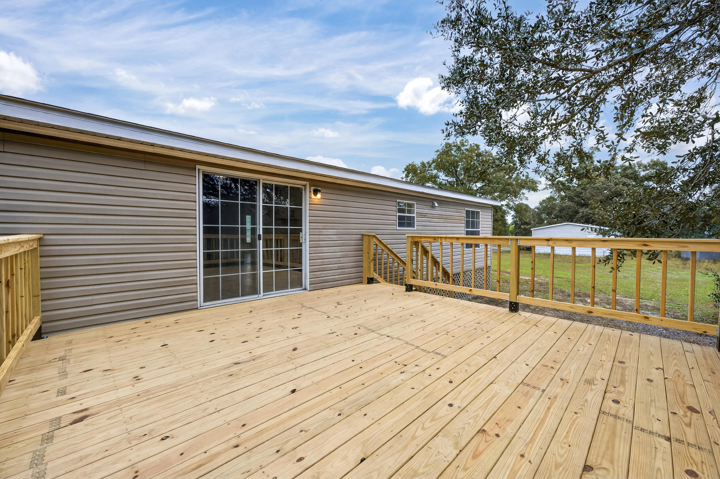 4580 Rainbird Rise Road Crestview, FL 32539 - Photo 39 of 41 a view of house with wooden floor and fence