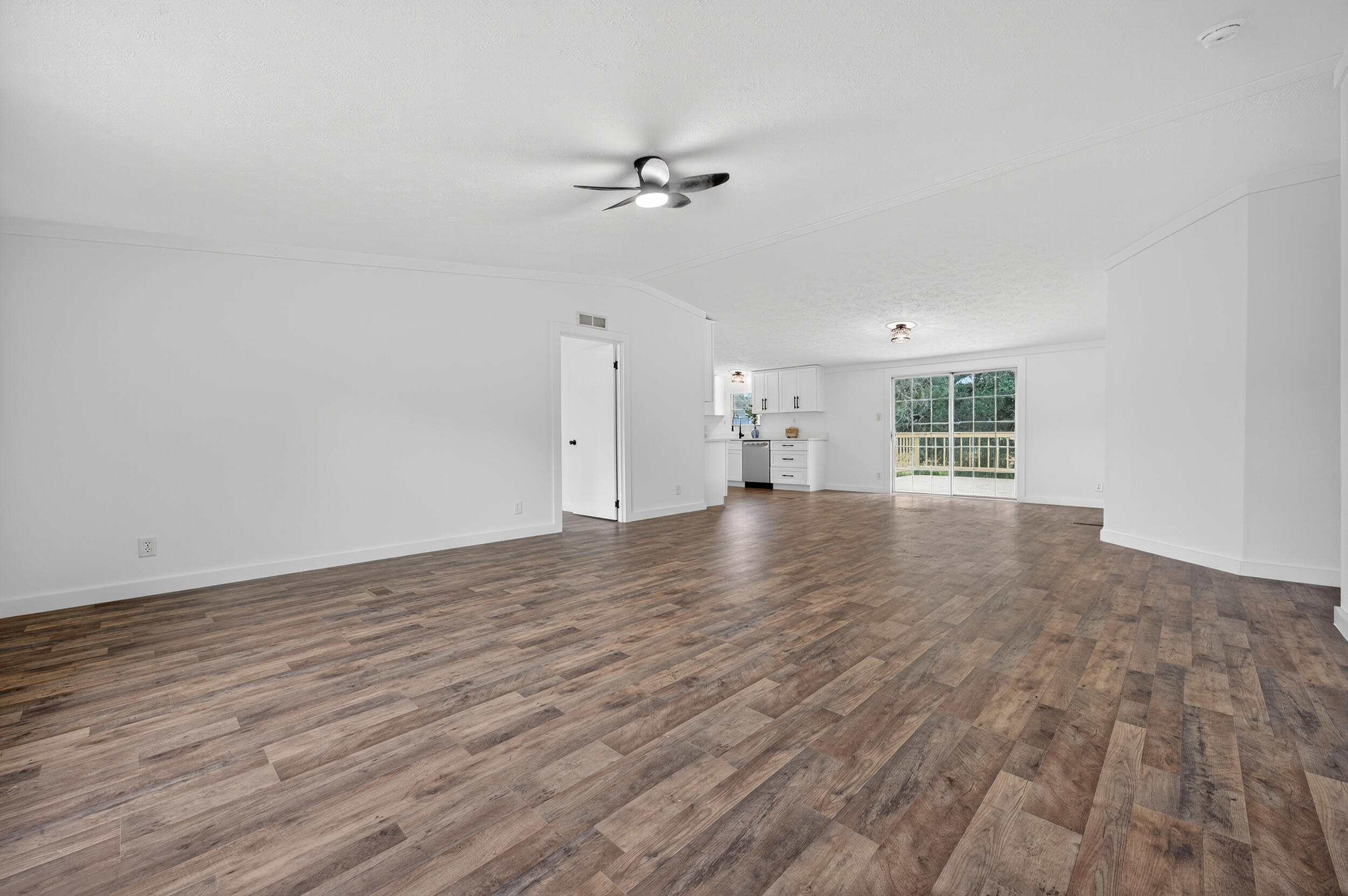 4580 Rainbird Rise Road Crestview, FL 32539 - Photo 7 of 41 wooden floor in an empty room with a window