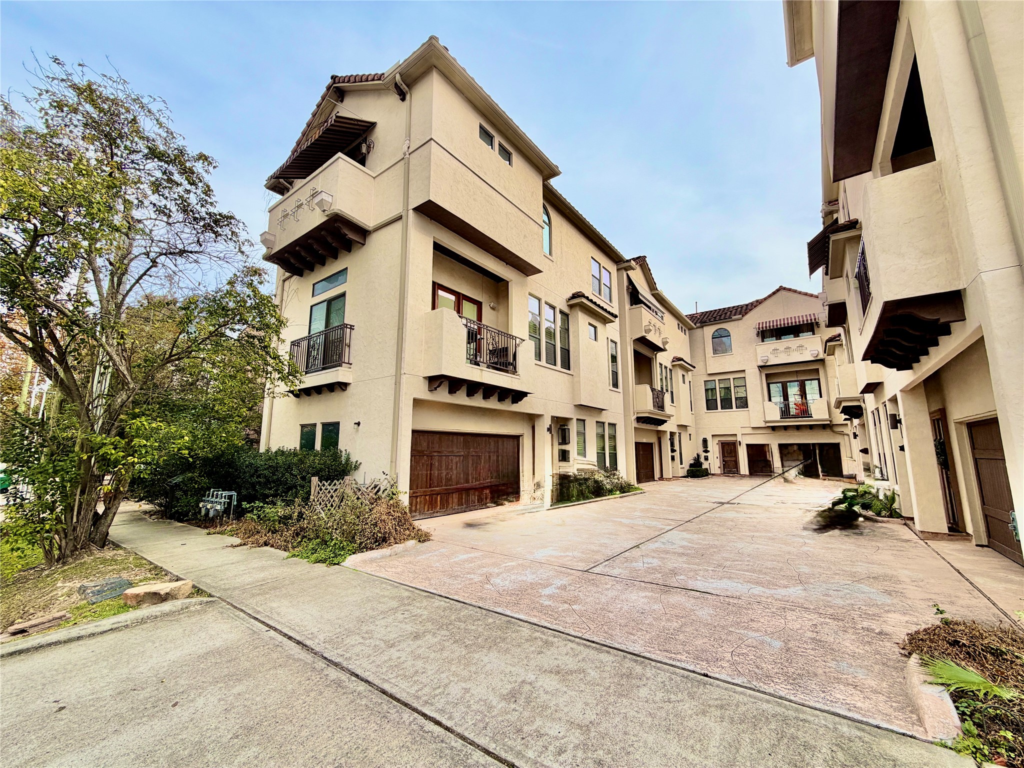 a front view of a residential houses with yard