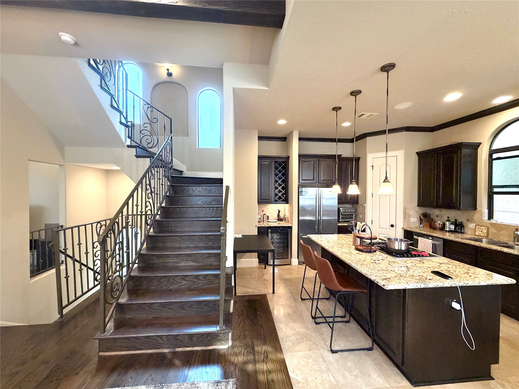508 Knox Street Houston, TX 77007 - Photo 12 of 25 a room with lots of wooden furniture and a chandelier