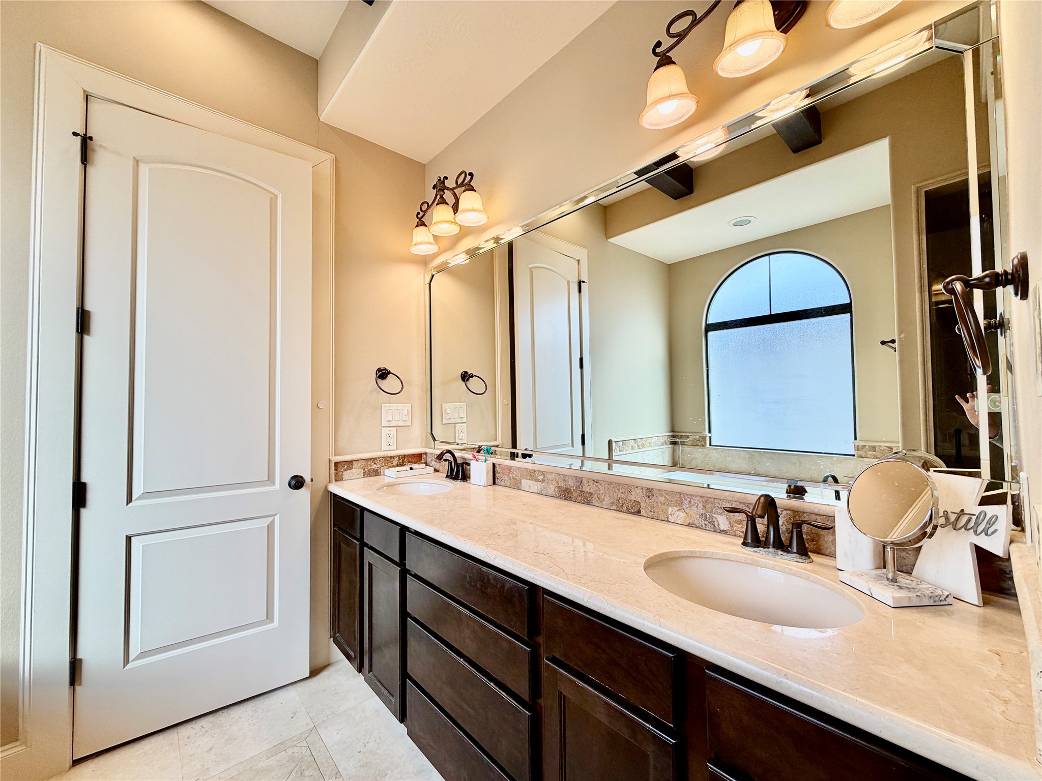 508 Knox Street Houston, TX 77007 - Photo 17 of 25 a bathroom with a double vanity sink and a mirror