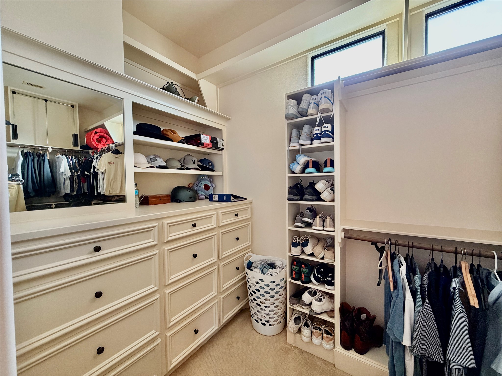 508 Knox Street Houston, TX 77007 - Photo 18 of 25 a view of walk in closet with clothes and shoes