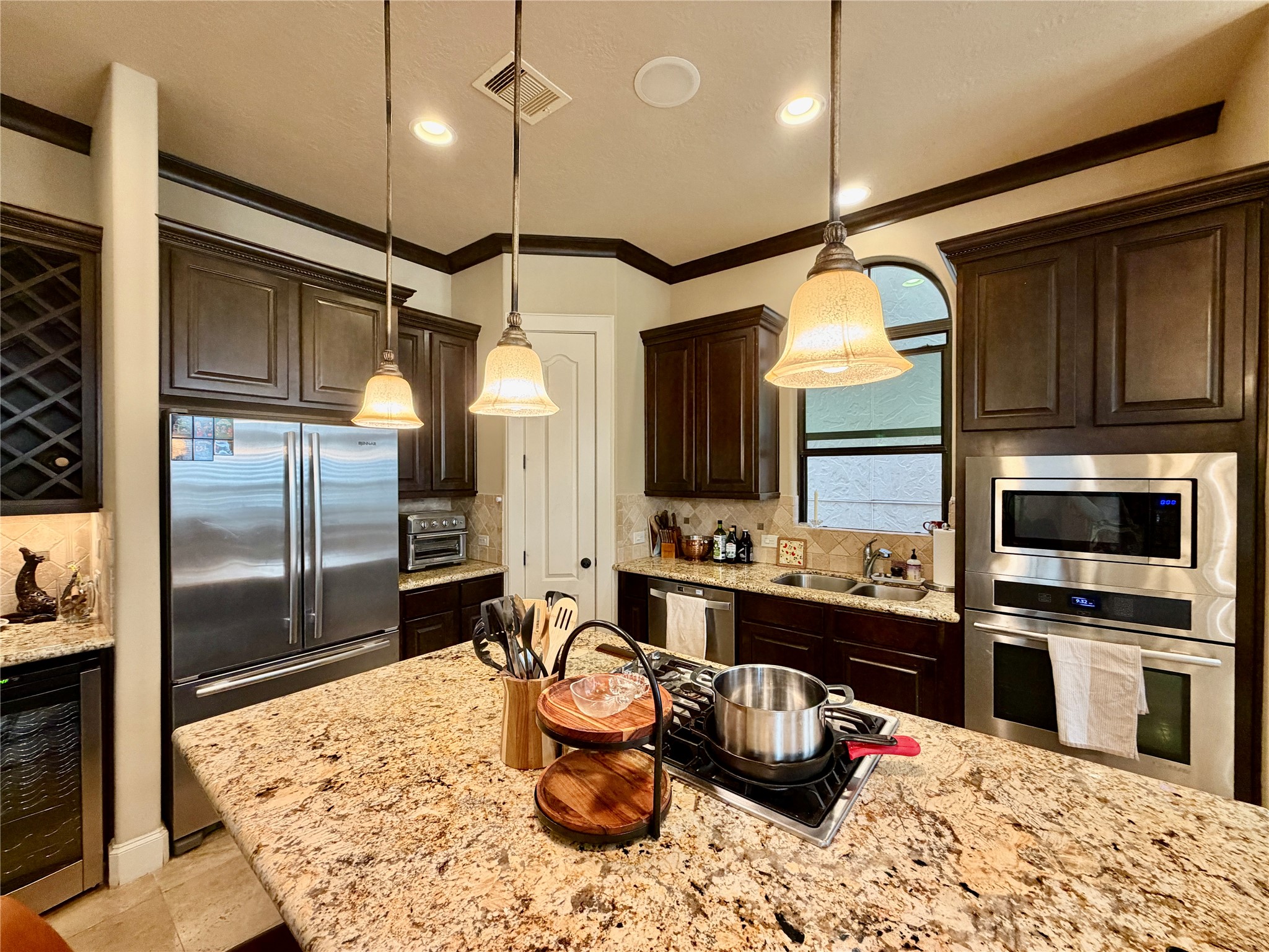 508 Knox Street Houston, TX 77007 - Photo 8 of 25 a kitchen with a refrigerator and a sink