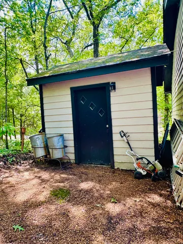 a small barn with a small yard