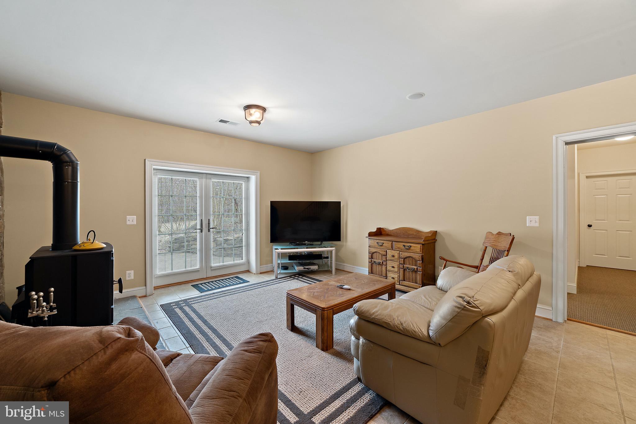 5462 Free State Road Marshall, VA 20115 - Photo 24 of 58 a living room with furniture and a flat screen tv