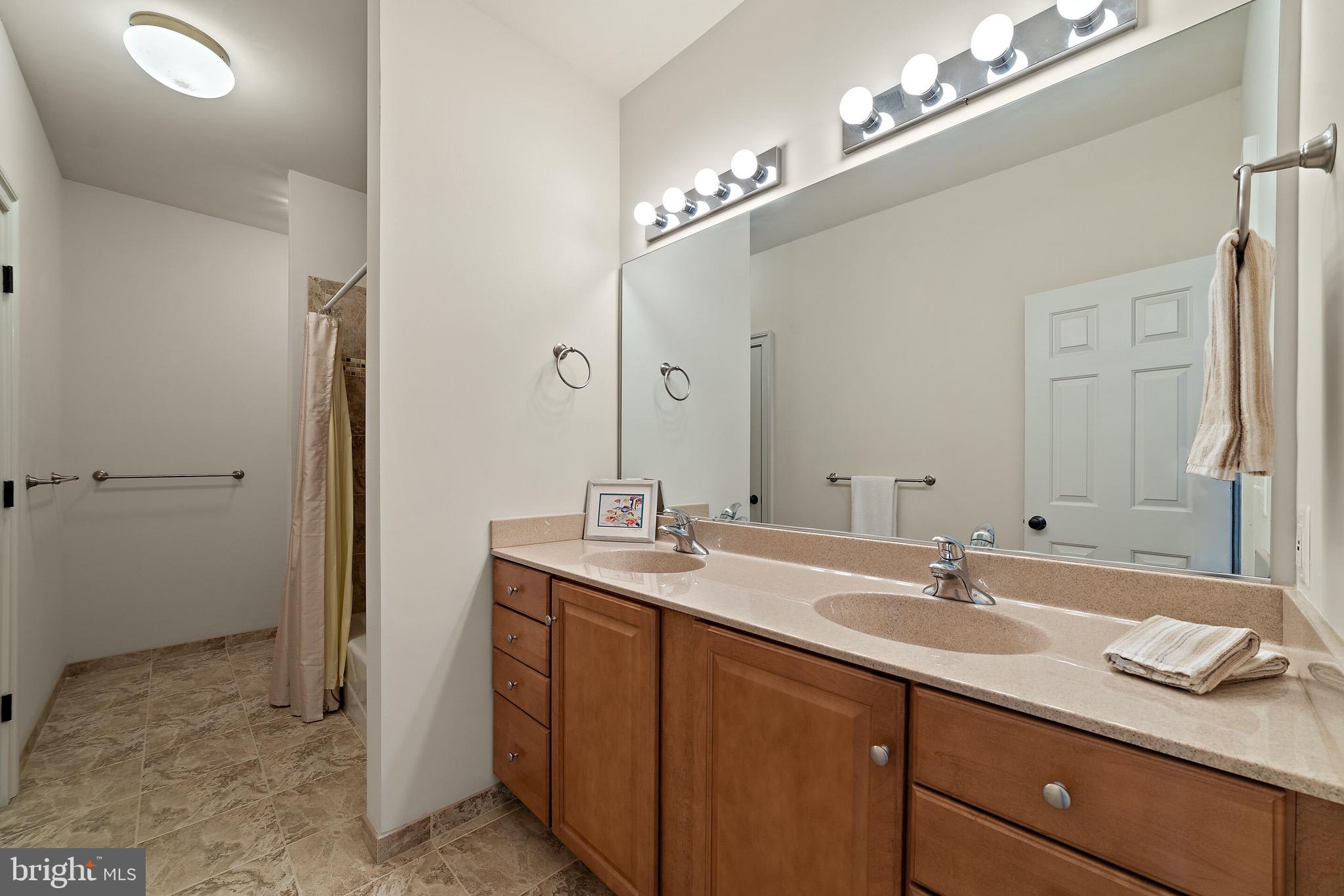 5462 Free State Road Marshall, VA 20115 - Photo 34 of 58 a bathroom with a granite countertop sink and a mirror
