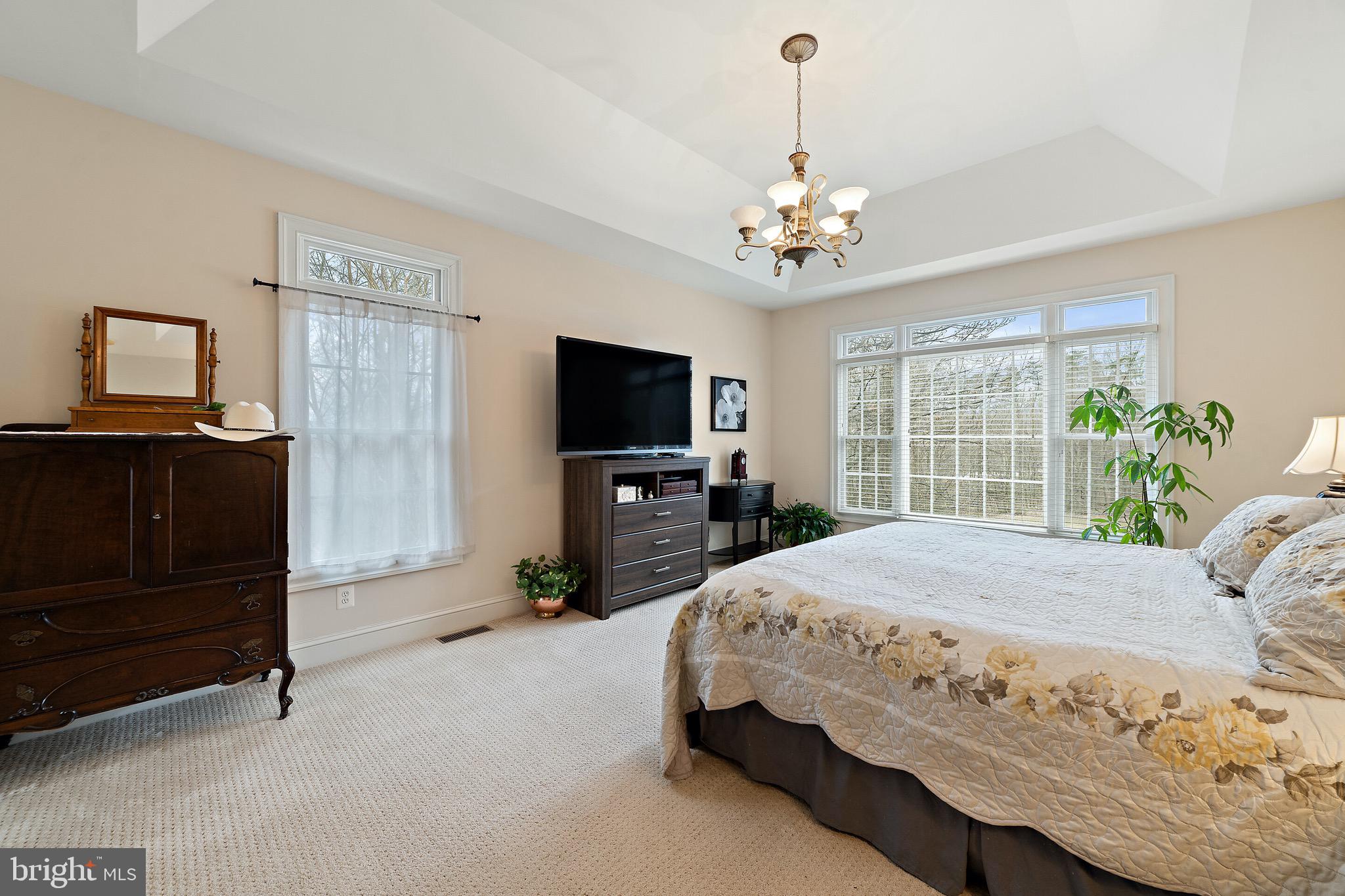 5462 Free State Road Marshall, VA 20115 - Photo 38 of 58 a spacious bedroom with a bed and a flat screen tv