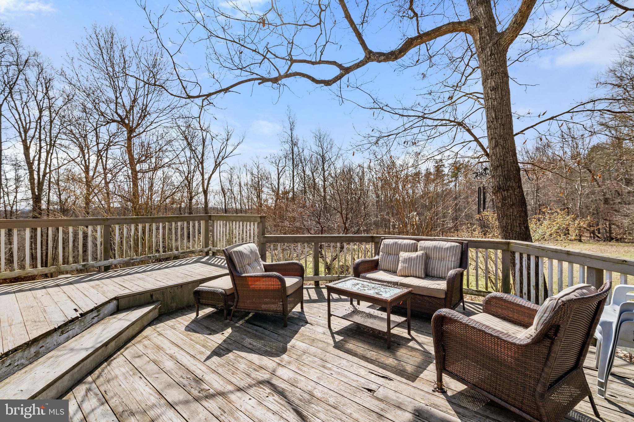 5462 Free State Road Marshall, VA 20115 - Photo 47 of 58 a balcony with wooden floor table and chairs